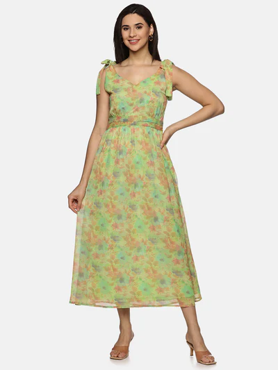 A model wearing a floral green maxi dress